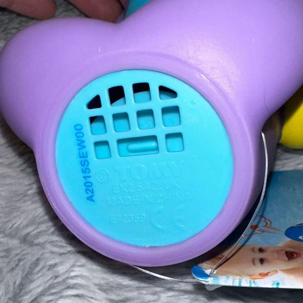 TOMY Water Whistlers Purple Dolphin Bath Toy E72379 Squirter Whistle 9m+